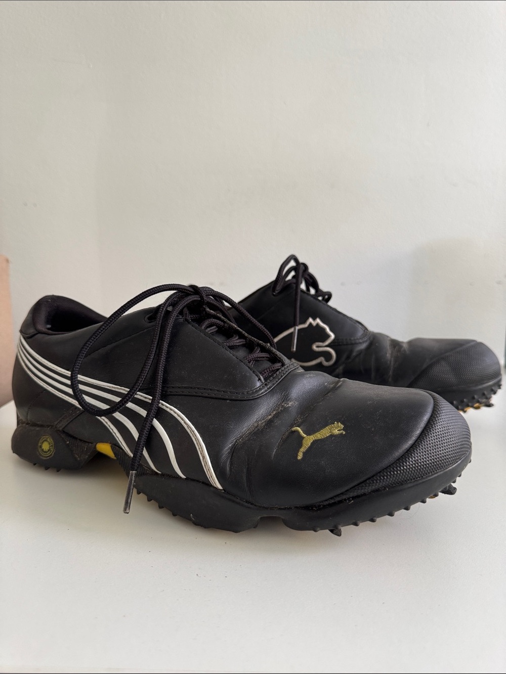 Puma Men’s Black Golf ⛳️ Shoes with White Stripes and Gold Logo